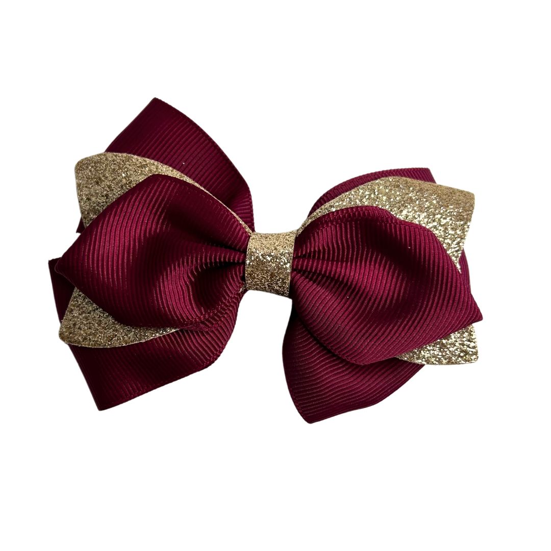 gymnastics bows, red bows, golden bows