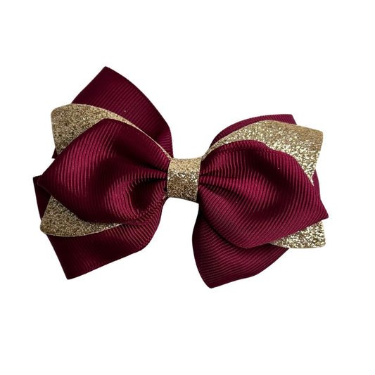 gymnastics bows, red bows, golden bows