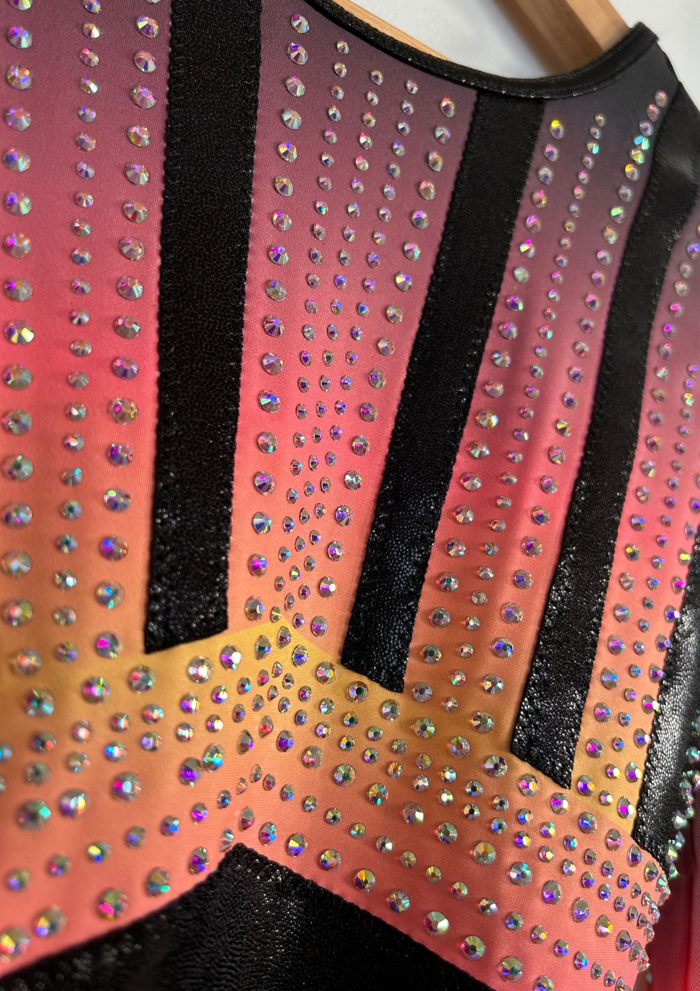 custom leotard, competition leotard, black leotard, pink leotard, long sleeve leotard, rhinestones, shiny leotard