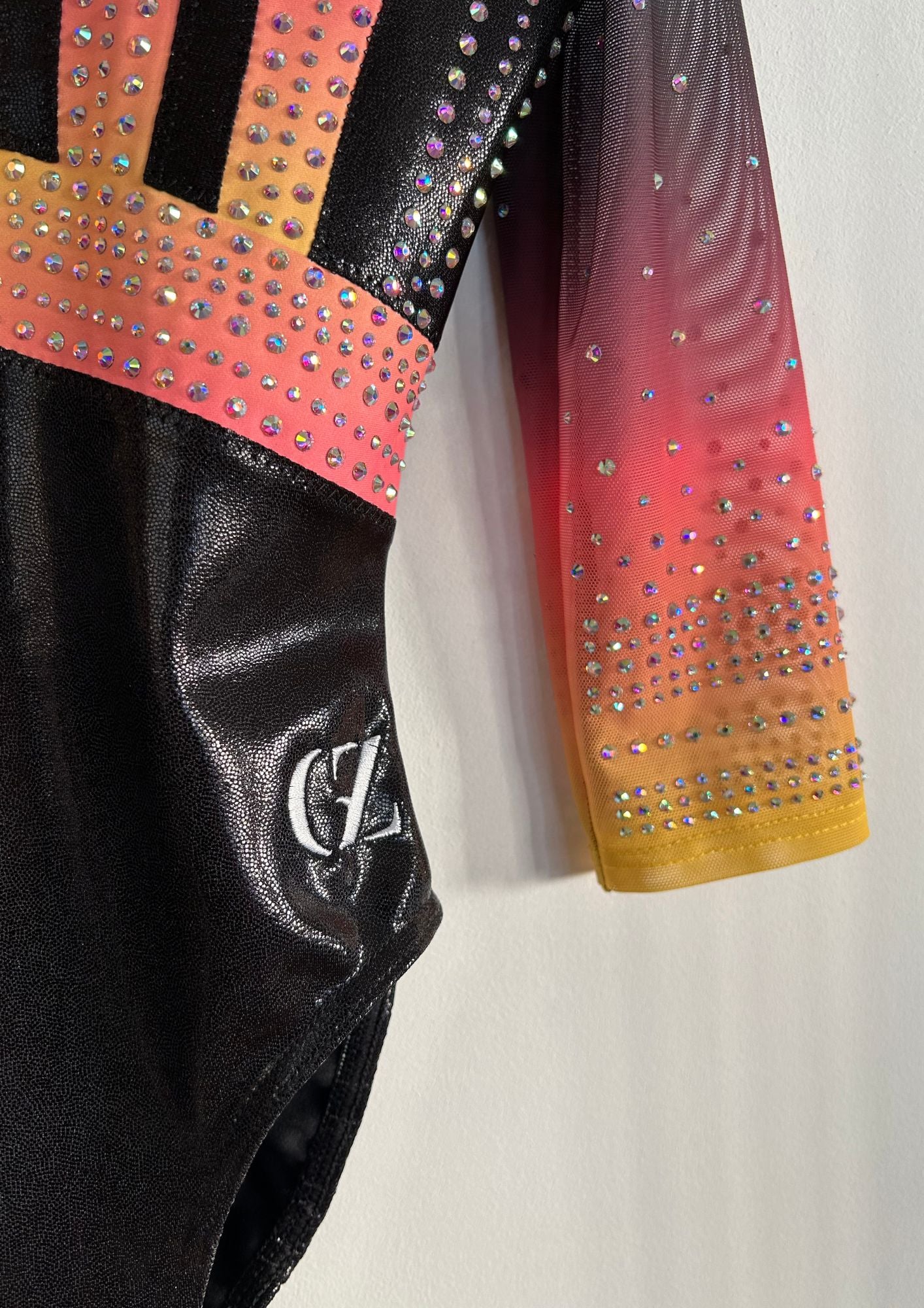 custom leotard, competition leotard, black leotard, pink leotard, long sleeve leotard, rhinestones, shiny leotard