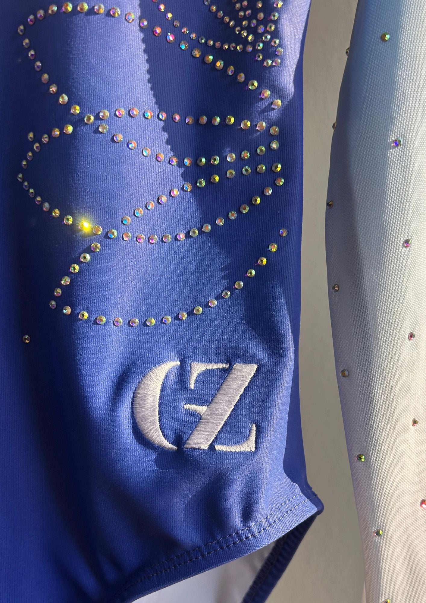 Gymnastics leotard with long sleeves and gradient design perfect for girl doing competitive gymnastic